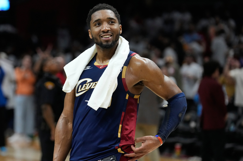 Cleveland Cavaliers guard Donovan Mitchell (45) smiles as fans cheer while he is interviewed after the Cavaliers defeated the Detroit Pistons in Game 3 of a second-round NBA playoffs basketball series Saturday, May 9, 2026 in Cleveland. (AP Photo/Sue Ogrocki)