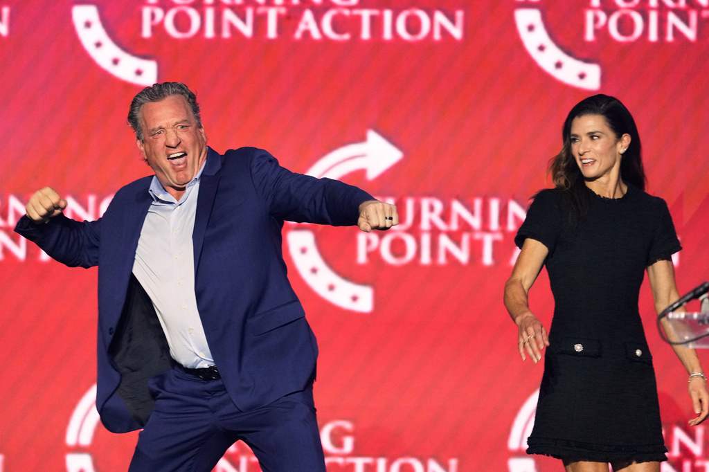 Jeremy Roenick, a former professional hockey player, and Danica Patrick, a former professional race car driver, participate in a Turning Point USA event Friday, April 17, 2026, in Phoenix. (AP Photo/Ross D. Franklin)