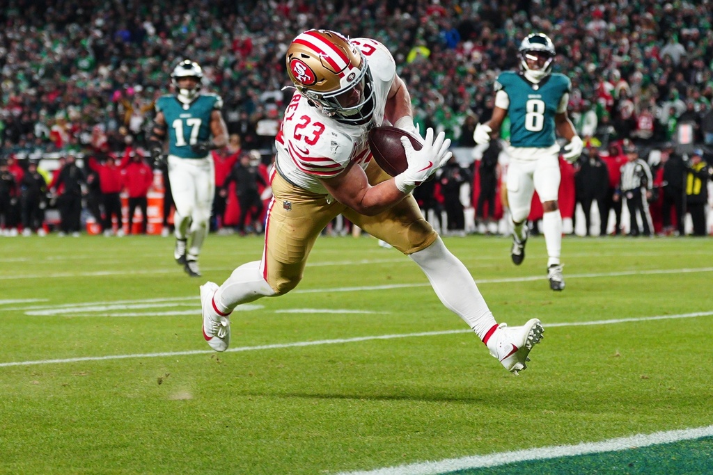 San Francisco 49ers running back Christian McCaffrey scores a touchdown during the second half of an NFL wild-card playoff football game against the Philadelphia Eagles on Sunday, Jan. 11, 2026, in Philadelphia. (AP Photo/Derik Hamilton)