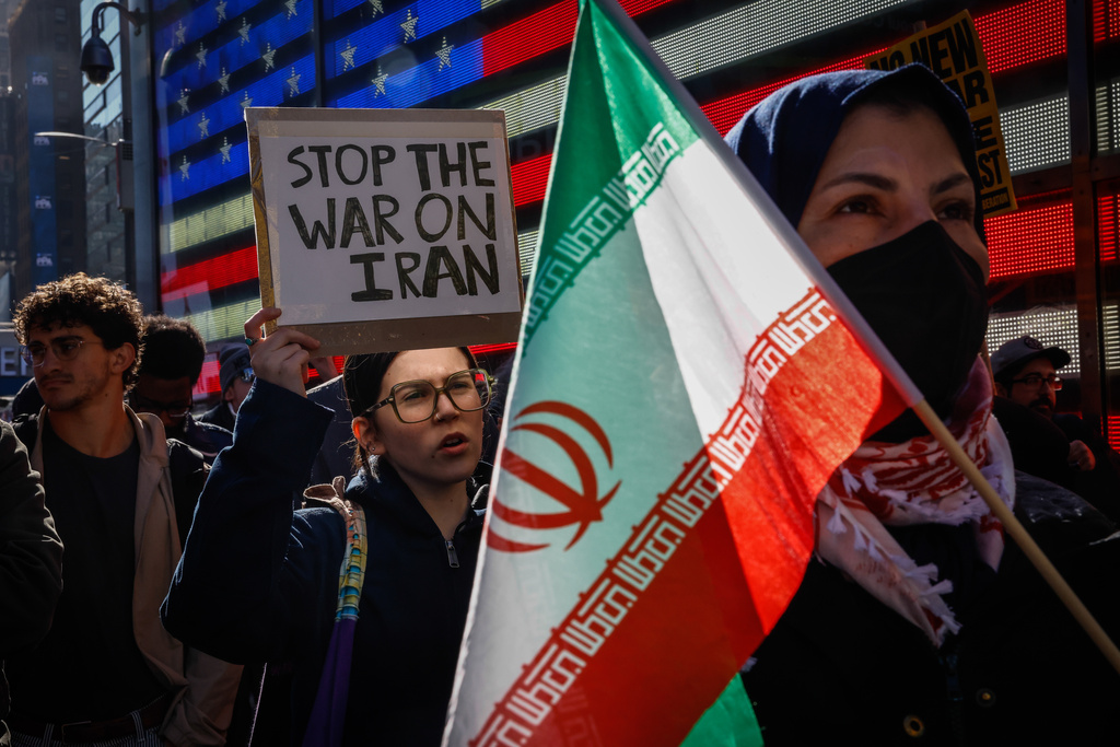 People protest against U.S. and Israeli strikes on Iran, in New York, Saturday, Feb. 28, 2026. (AP Photo/Kena Betancur)