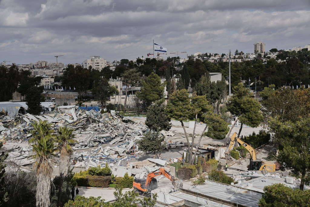 Israeli bulldozers demolish a UNRWA compound, belonging to the U.N. agency that assists Palestinian refugees, in east Jerusalem Tuesday, Jan. 20, 2026. (AP Photo/Mahmoud Illean)