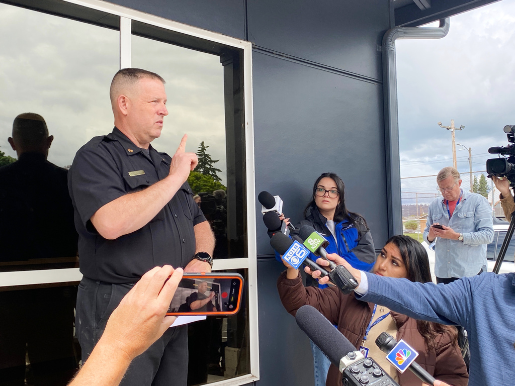 Cowlitz 2 Fire & Rescue Chief Scott Goldstein speaks on developments after a hazardous liquid implosion at the Nippon Dynawave Packaging Co. on Tuesday, May 26, 2026 in Longview, Wash. (AP Photo/Claire Rush)