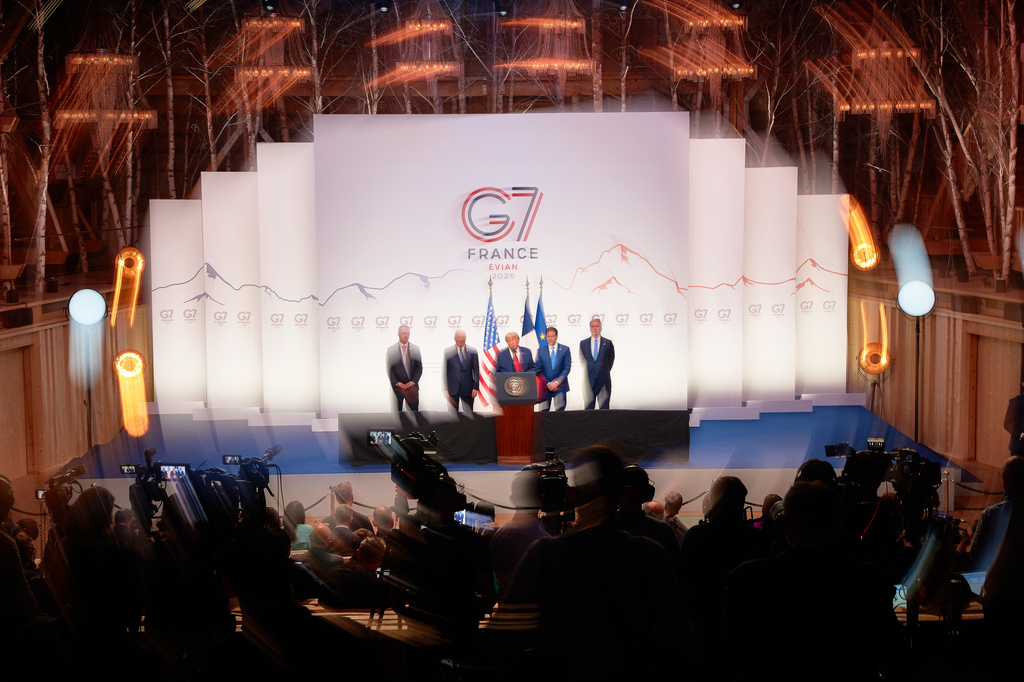 In a photo taken with slow shutter speed and zoom effect, U.S. President Donald Trump, center, speaks as he is flanked by, from left, U.S Trade Representative Jamieson Greer, U.S. Secretary of Commerce Howard Lutnick, United States Secretary of State Marco Rubio and U.S. Treasury Secretary Scott Bessent during a media conference at the end of the G7 summit in Evian-les-Bains, France, Wednesday, June 17, 2026. (AP Photo/Vadim Ghirda)