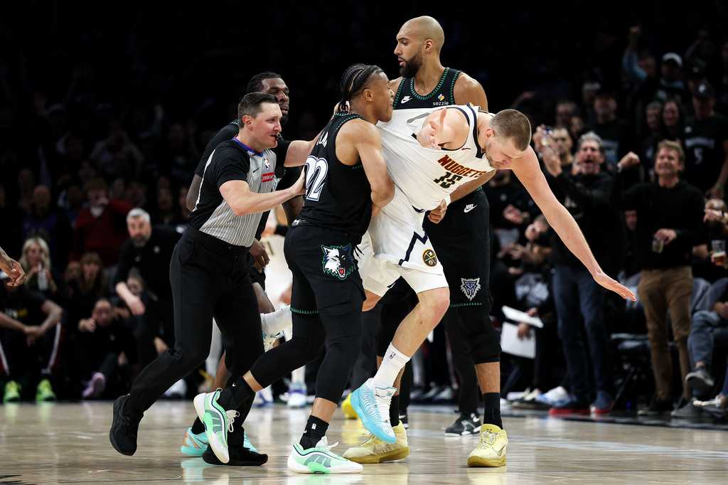 Denver Nuggets center Nikola Jokic and Minnesota Timberwolves guard Jaylen Clark get into an altercation during the second half of Game 6 of a first-round NBA basketball playoffs series, Thursday, April 30, 2026, in Minneapolis. (AP Photo/Matt Krohn)