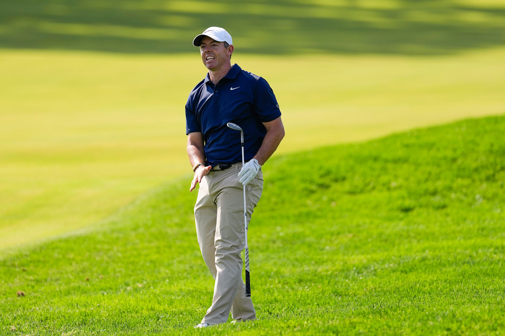 Rory McIlroy, of Northern Ireland, watches his shot on the 11th fairway during the final round of the PGA Championship golf tournament at Aronimink Golf Club, Sunday, May 17, 2026, in Newtown Square, PA. (AP Photo/Carolyn Kaster)