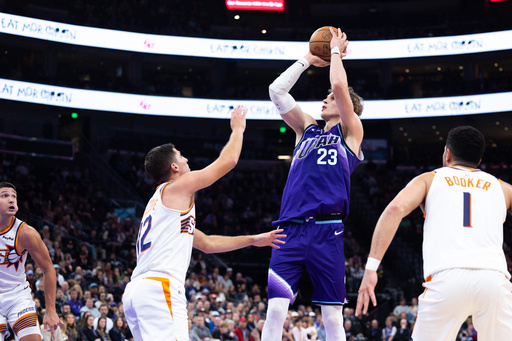Utah Jazz forward Lauri Markkanen (23) shoots over Phoenix Suns guard Collin Gillespie (12) during the second half of an NBA basketball game, Monday, Oct. 27, 2025, in Salt Lake City. (AP Photo/Anna Fuder) Utah Jazz forward Lauri Markkanen (23) shoots over Phoenix Suns guard Collin Gillespie (12) during the second half of an NBA basketball game, Monday, Oct. 27, 2025, in Salt Lake City. (AP Photo/Anna Fuder)