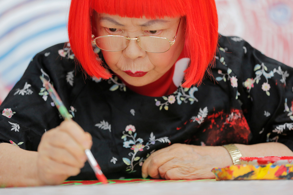 Japanese avant-garde artist Yayoi Kusama works at her studio in Tokyo, Wednesday Aug 1, 2012. (AP Photo/Itsuo Inouye, File)