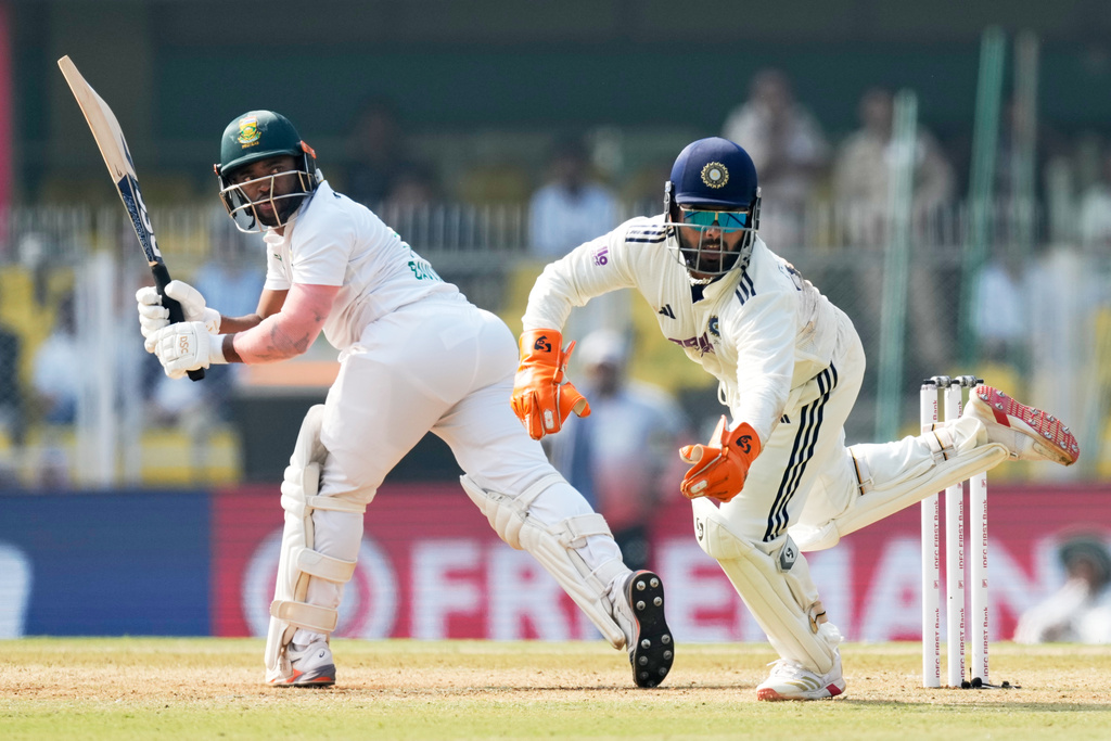 India's captain Rishab Pant attempts unsuccessfully the dismissal of South Africa's captain Temba Bavuma on the fourth day of the second cricket test match between India and South Africa in Guwahati, India, Saturday, Nov. 22, 2025. (AP Photo/Anupam Nath)