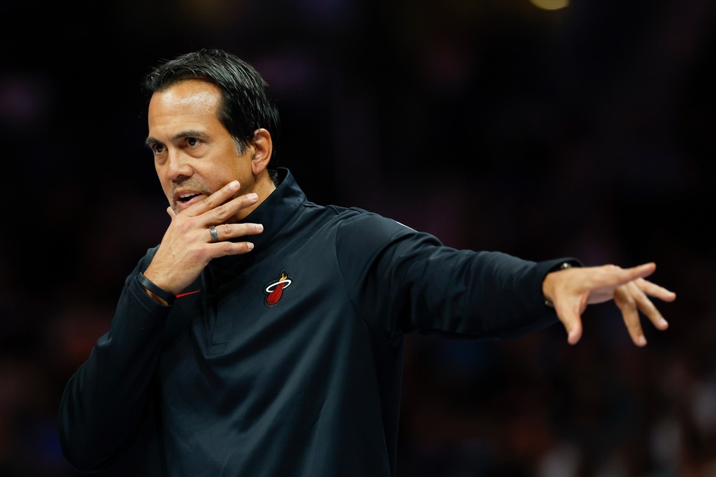 Miami Heat head coach Erik Spoelstra directs his team during the first half of an NBA basketball game against the Charlotte Hornets in Charlotte, N.C., Friday, March 6, 2026. (AP Photo/Nell Redmond)