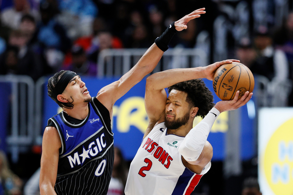 Orlando Magic guard Anthony Black (0) guards Detroit Pistons guard Cade Cunningham (2) during the second half in Game 5 of a first-round NBA basketball playoffs series Wednesday, April 29, 2026, in Detroit. (AP Photo/Duane Burleson)