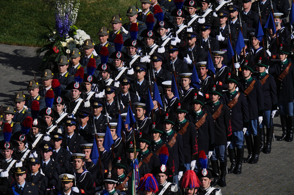 Italian military personnel in historical uniforms stand in St. Peter's Square at the Vatican prior to Easter Mass presided over by Pope Leo XIV, Sunday, April 5, 2026 (AP Photo/Alessandra Tarantino)