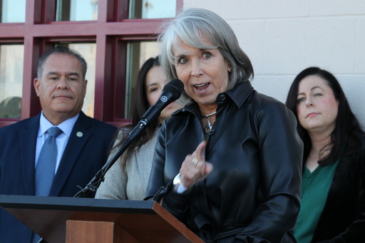 New Mexico Gov. Michelle Lujan Grisham, center, announces the state will provide $30 million in emergency food assistance to residents to temporarily backfill SNAP benefits during a news conference outside a grocery store in Albuquerque, New Mexico, on Wednesday, Oct. 29, 2025. (AP Photo/Susan Montoya Bryan) New Mexico Gov. Michelle Lujan Grisham, center, announces the state will provide $30 million in emergency food assistance to residents to temporarily backfill SNAP benefits during a news conference outside a grocery store in Albuquerque, New Mexico, on Wednesday, Oct. 29, 2025. (AP Photo/Susan Montoya Bryan)