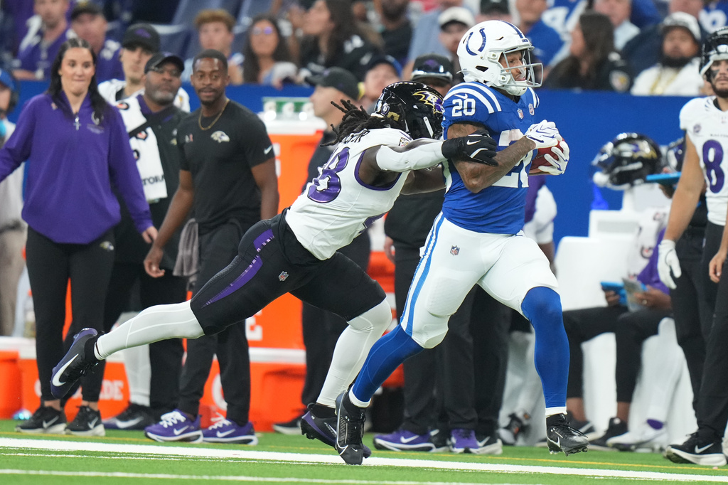Indianapolis Colts' Seth McGowan is stopped by Baltimore Ravens' Carl Jones after a long kick off return during the second half of an NFL football game Sunday, Sept. 13, 2026, in Indianapolis. (AP Photo/AJ Mast)