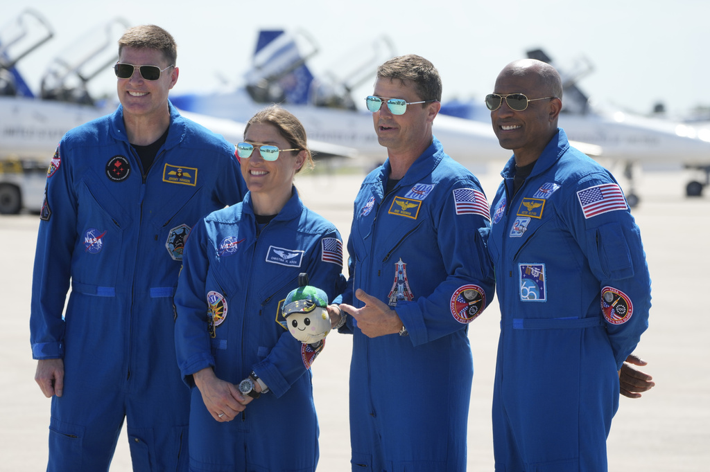 Artemis 2 crew members, from left, Mission Spc. Jeremy Hansen, of Canada, Mission Spc. Christina Koch, Commander Reid Wiseman, and Pilot Victor Glover pose for a photo after the crew's arrival at the Kennedy Space Center Friday, March 27, 2026, in Cape Canaveral, Fla. (AP Photo/Chris O'Meara)