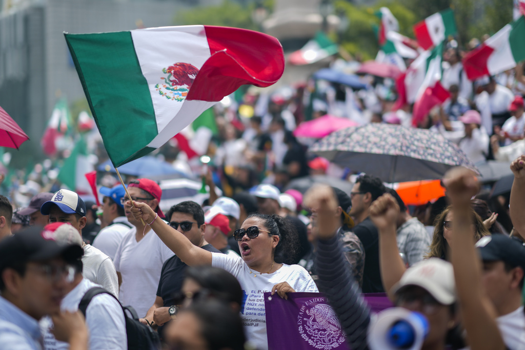 FILE - Judicial workers protest the government's judicial reform, which was approved in the Senate and would make judges stand for election, in Mexico City, Sept. 11, 2024. (AP Photo/Eduardo Verdugo, File)