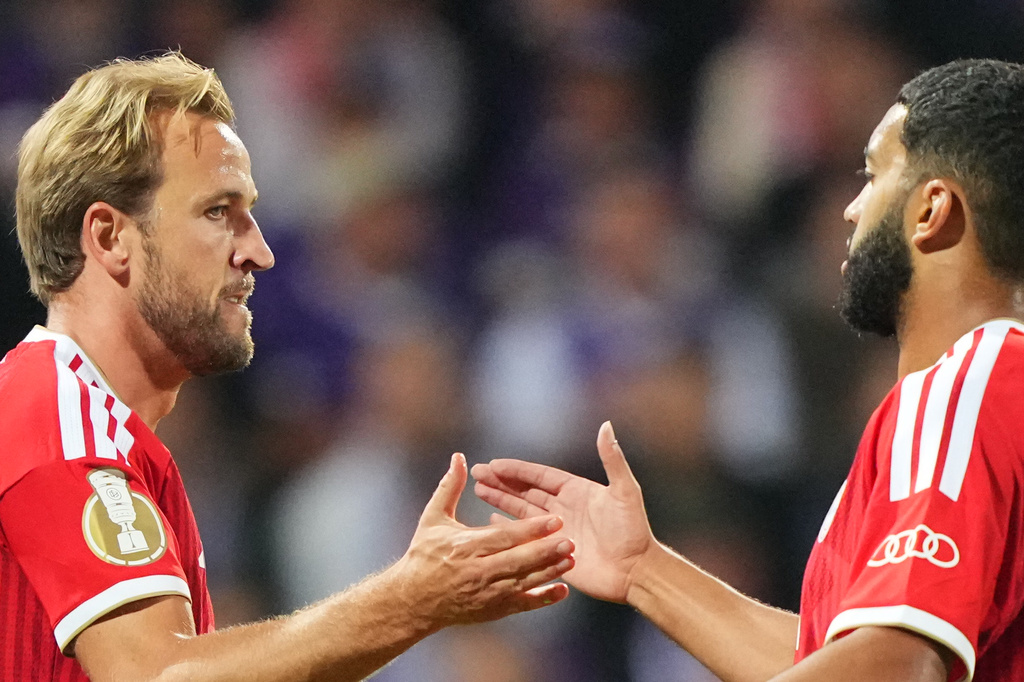 Bayern's Harry Kane, left, celebrates with Bayern's Ismael Saibari after scoring his side's opening goal during the German soccer cup match between VfL Osnabrueck and Bayern Munich in Osnabrueck, Germany, Wednesday, Sept. 2, 2026. (AP Photo/Martin Meissner)