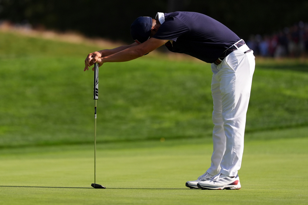 United States' Collin Morikawa reacts after missing a putt on the 13th hole at Bethpage Black golf course during the Ryder Cup golf tournament, Saturday, Sept. 27, 2025, in Farmingdale, N.Y. (AP Photo/Lindsey Wasson)