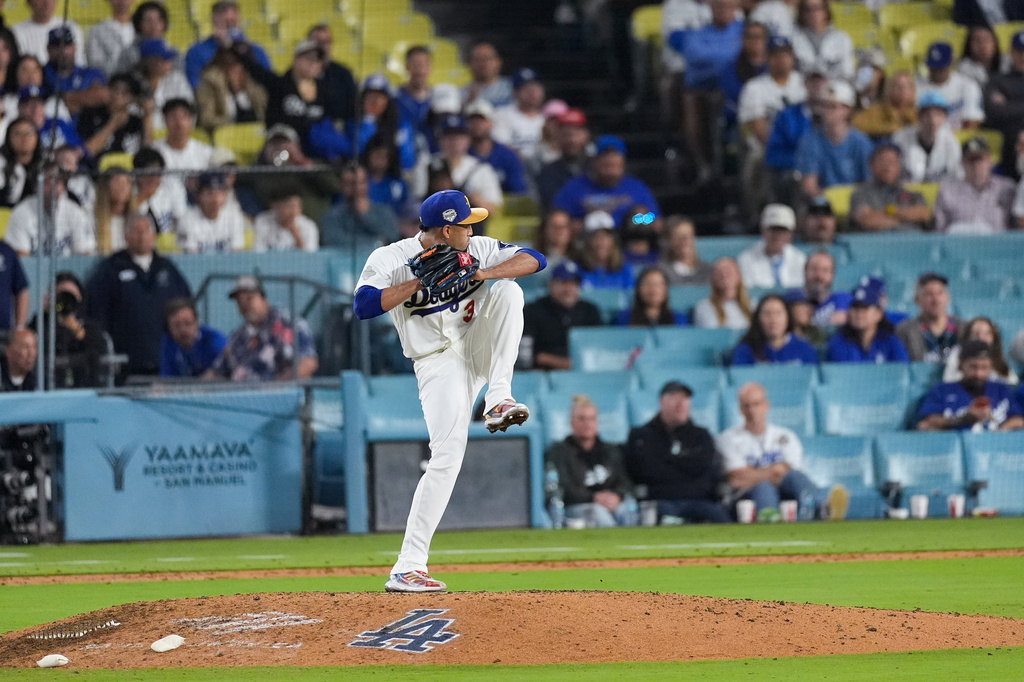 Los Angeles Dodgers relief pitcher Edwin Diaz (3) pitches during the first inning of a baseball game against the Arizona Diamondbacks, Friday, March 27, 2026, in Los Angeles. (AP Photo/Caroline Brehman)