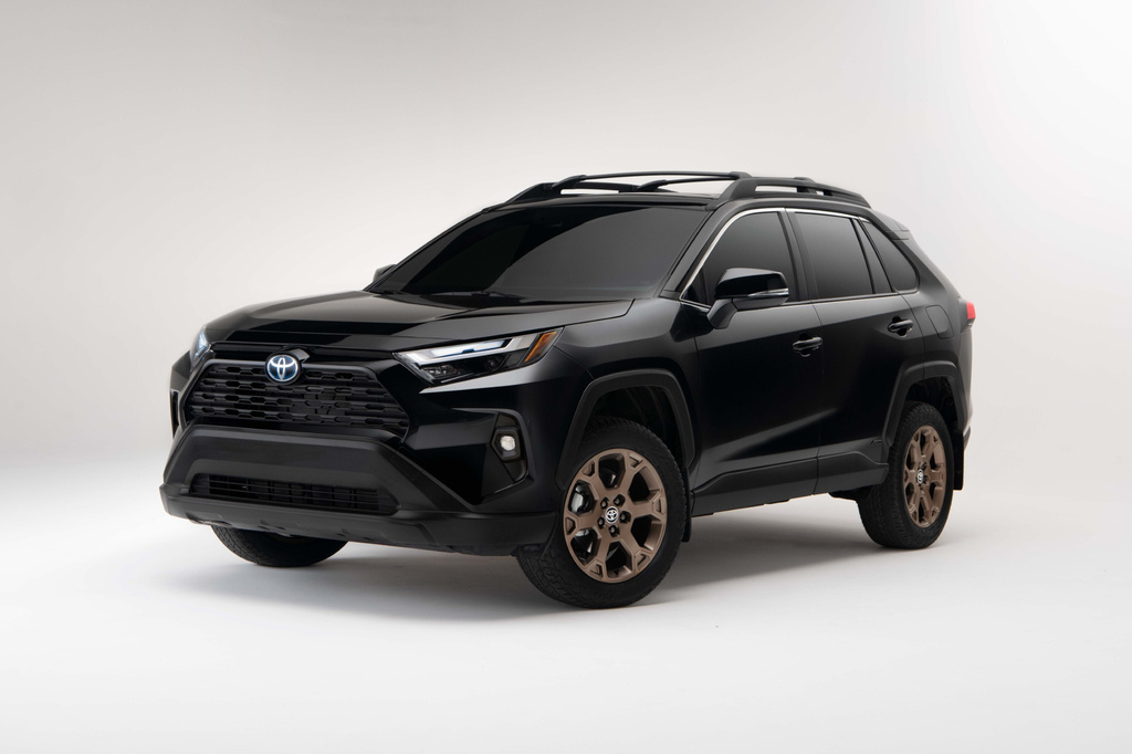 This photo provided by Toyota shows the 2023 RAV4 Hybrid. This SUV combines a roomy interior and smooth ride with the practical benefits of large cargo space and impressive fuel savings. (Courtesy of Toyota Motor Sales U.S.A. via AP)