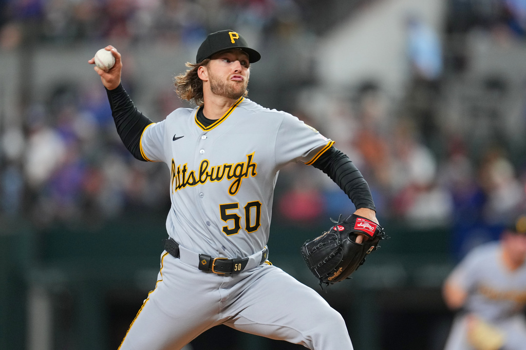 Pittsburgh Pirates starting pitcher Carmen Mlodzinski throws the Texas Rangers during the first inning of a baseball game Tuesday, April 21, 2026, in Arlington, Texas. (AP Photo/Julio Cortez)