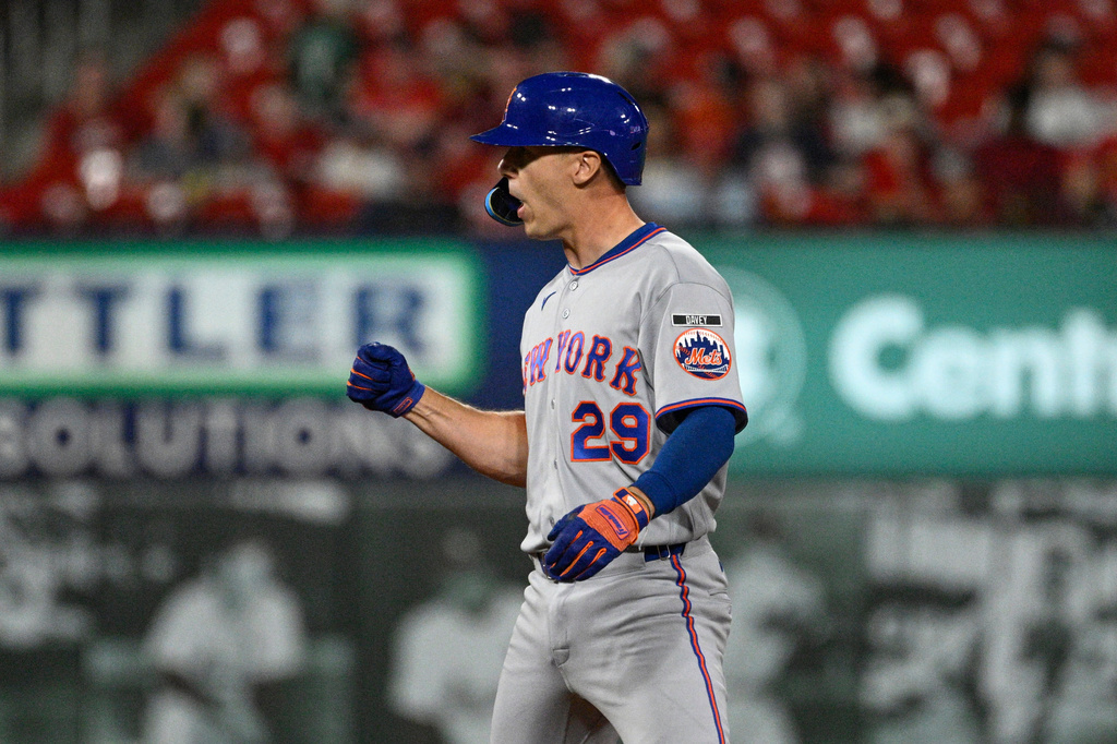 New York Mets' Jared Young celebrates after hitting an RBI double in the sixth inning of a baseball game against the St. Louis Cardinals, Monday, March 30, 2026, in St. Louis. (AP Photo/Joe Puetz)