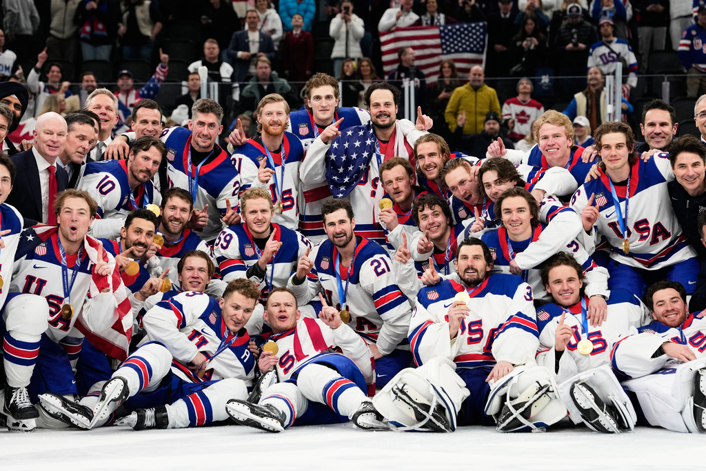 Gold medalists of the United States pose after the men's ice hockey gold medal game between Canada and the United States at the 2026 Winter Olympics, in Milan, Italy, Sunday, Feb. 22, 2026. (AP Photo/Hassan Ammar)