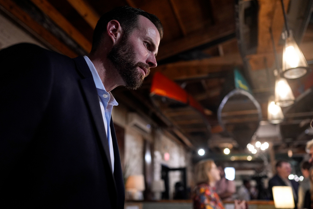 Republican Clay Fuller speaks to a supporter during an election night watch party for Fuller, who's running in Georgia's 14th Congressional District, Tuesday, March 10, 2026, in Rome, Ga. (AP Photo/Mike Stewart)