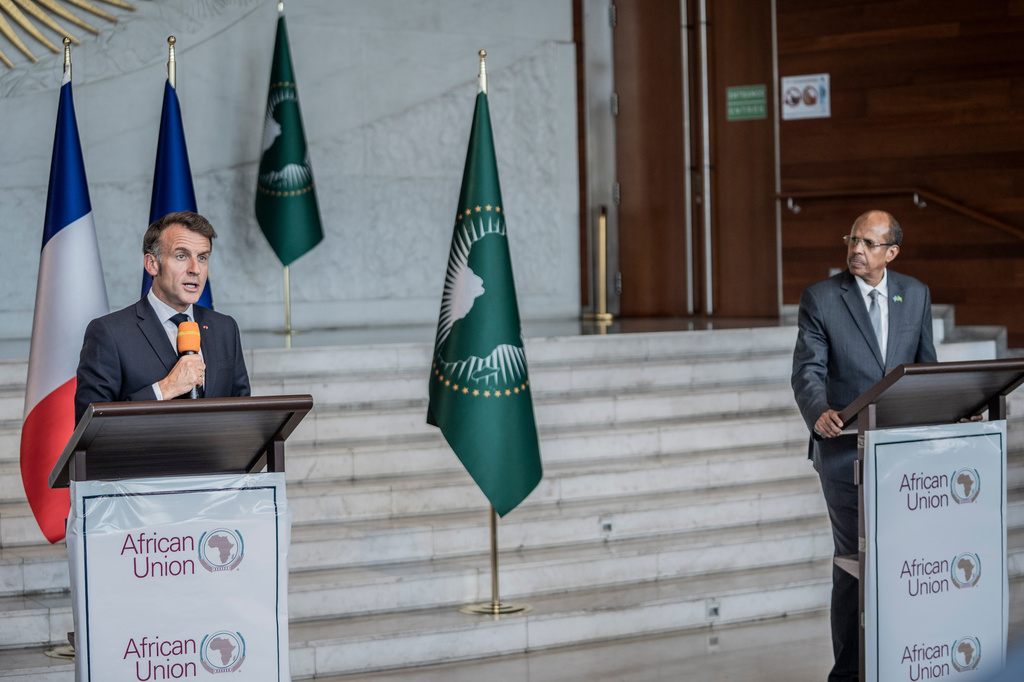 African Union Commission Chairperson Mahmoud Ali Youssouf, right, and France's President Emmanuel Macron speak during a joint press conference at the African Union headquarters in Addis Ababa, Ethiopia, Wednesday, May 13, 2026. (AP Photo/Amanuel Sileshi)