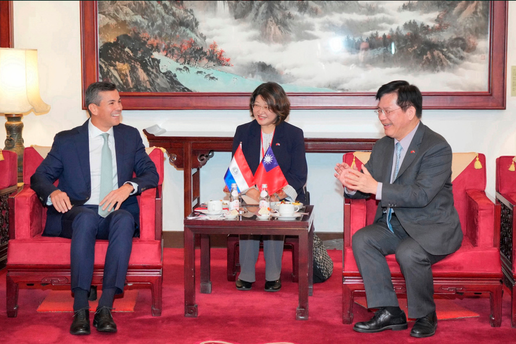In this image taken from video released by the Taiwan Ministry of Foreign Affairs, Paraguayan President Santiago Peña, left, meets Taiwan's Foreign Minister Lin Chia-lung, right, upon arrival in Taipei, Taiwan on Thursday, May 7, 2026. (Taiwan Ministry of Foreign Affairs via AP)