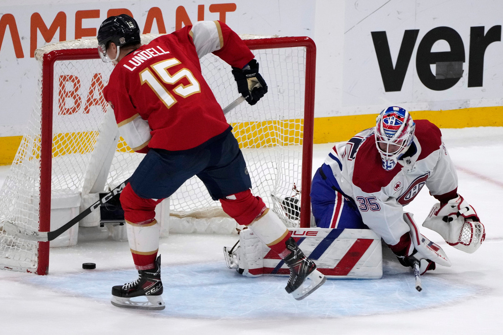 FILE - Florida Panthers center Anton Lundell (15) shoots the game-winning goal against Montreal Canadiens goaltender Sam Montembeault (35) during the shootout in an NHL hockey game Feb. 29, 2024, in Sunrise, Fla. (AP Photo/Lynne Sladky, File)