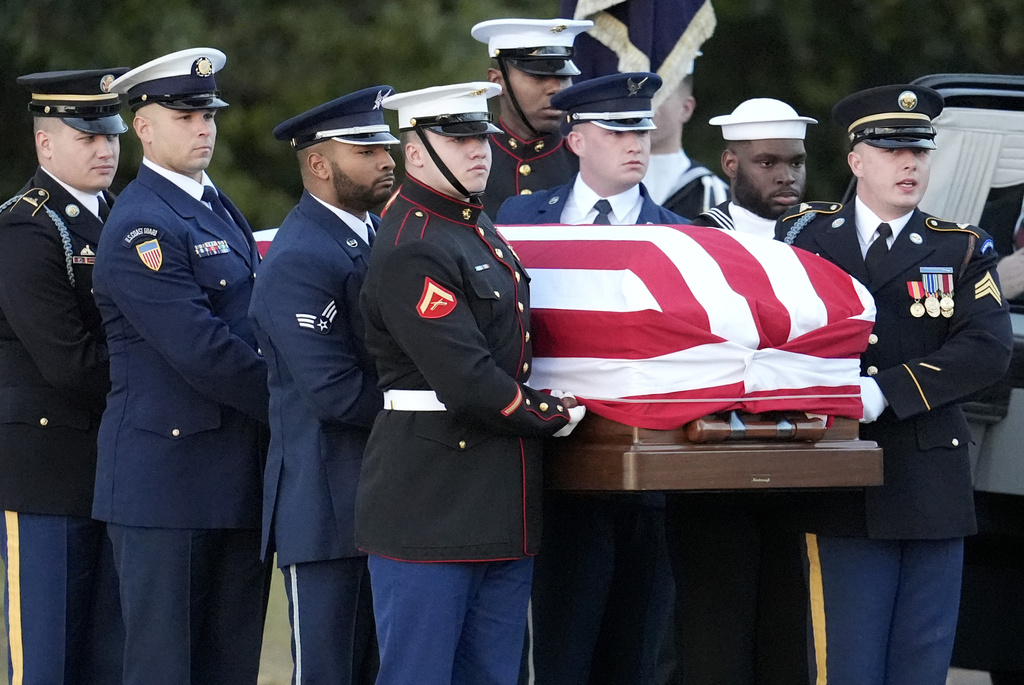 The flag-draped casket of former President Jimmy Carter is carried into Maranatha Baptist Church for a funeral service, Thursday, Jan. 9, 2025, in Plains, Ga. (AP Photo/Mike Stewart)