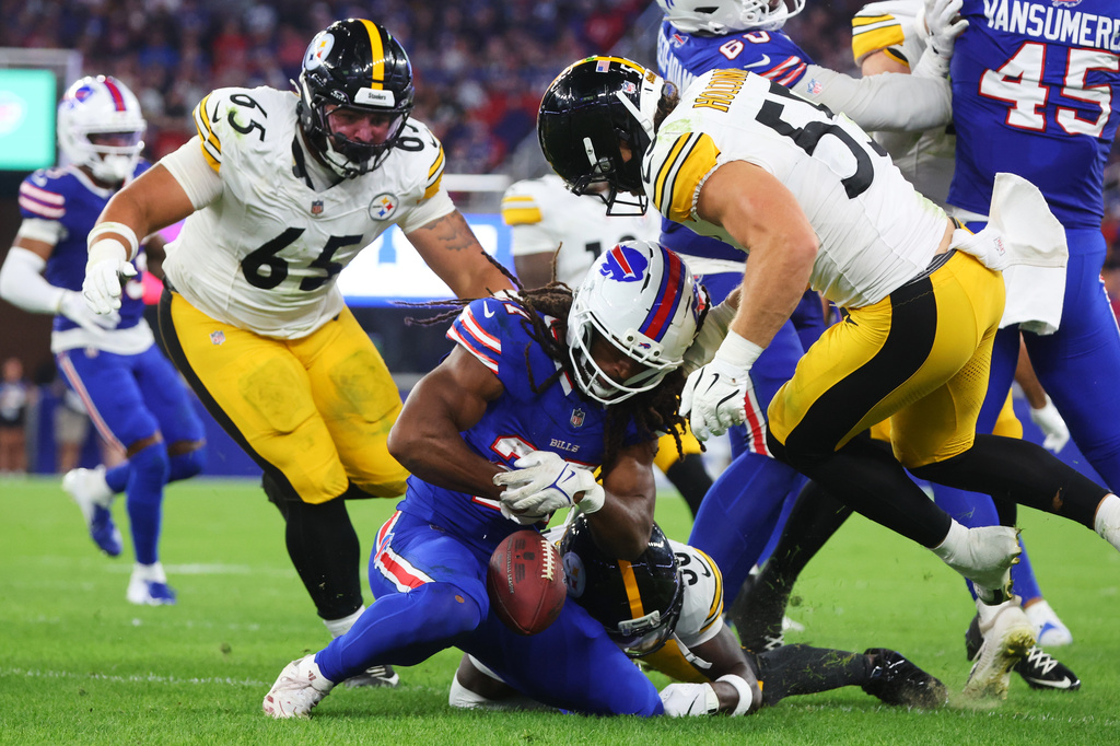 Buffalo Bills running back Ian Wheeler (27) recovers his own fumble as Pittsburgh Steelers defensive tackle Kyler Baugh (65) and Cole Holcomb (55) move in to make the stop in the second half of a preseason NFL football game in Orchard Park, NY., Thursday, Aug. 27, 2026. (AP Photo/Jeffrey T. Barnes)