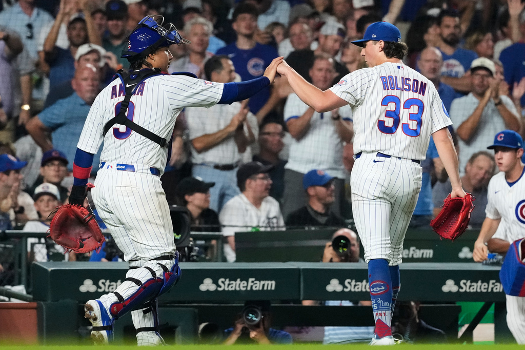 Chicago Cubs relief pitcher Ryan Rolison (33) reacts with catcher Miguel Amaya, left, during the fifth inning of a baseball game against the Detroit Tigers in Chicago, Monday, July 20, 2026. (AP Photo/Nam Y. Huh)