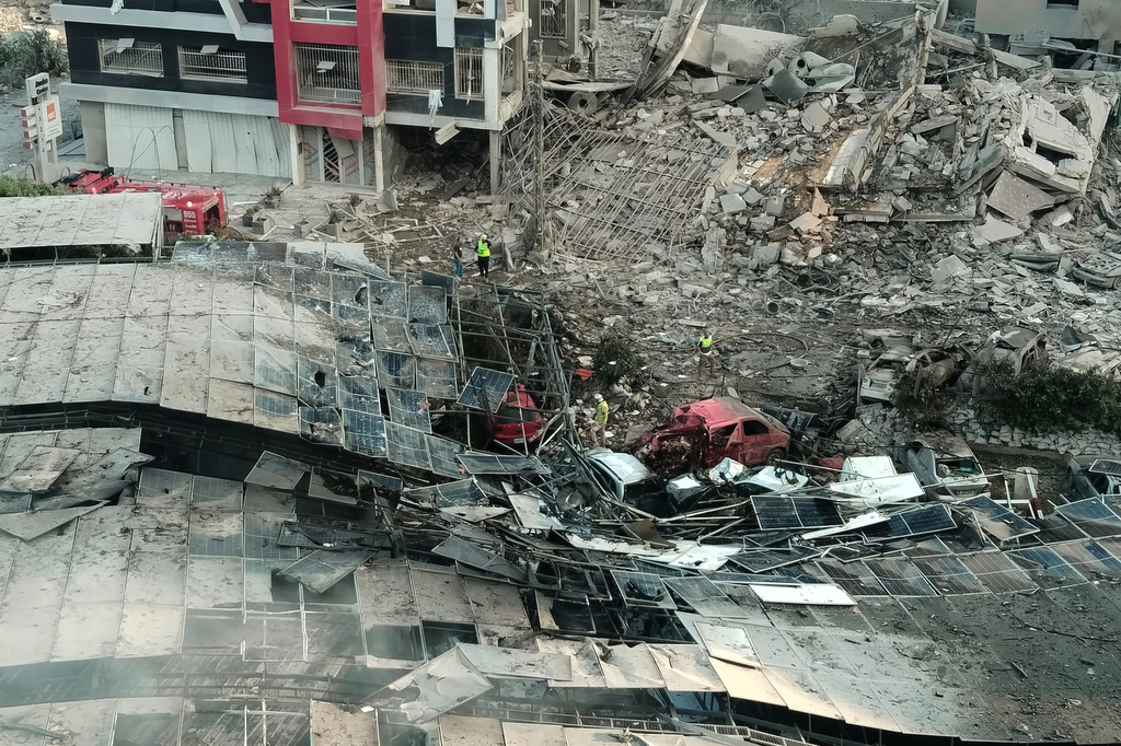 Rescuers work at the site of an Israeli airstrike that hit a building and damaged a hospital, in the southern port city of Tyre, Lebanon, Monday, June 1, 2026. (AP Photo)