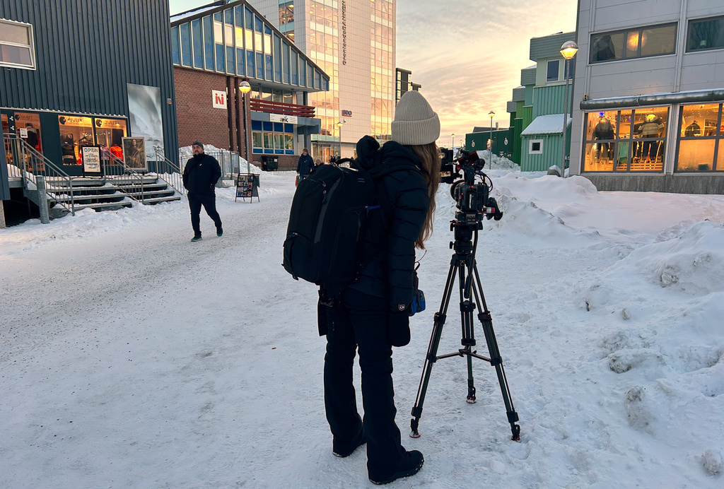 A journalist films in Nuuk, Greenland, Thursday, Jan. 15, 2026. (AP Photo/Emma Burrows)