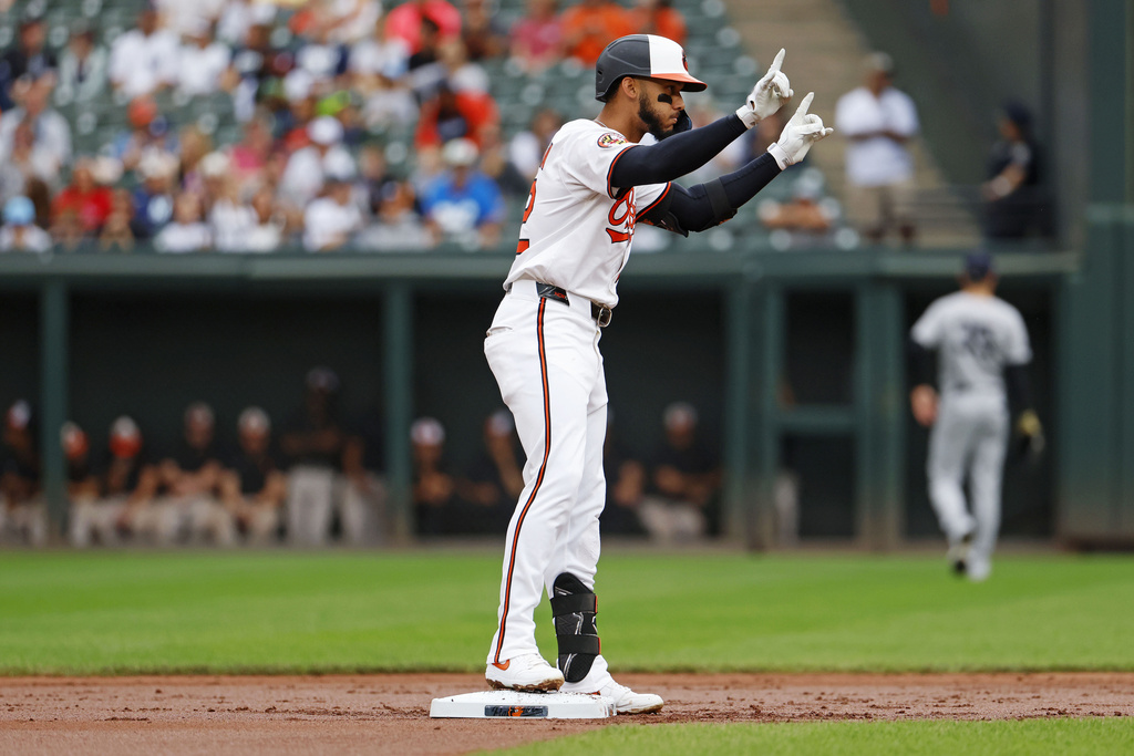 Baltimore Orioles second base Jeremiah Jackson (82) celebrates toward his dugout after hitting a double during the second inning of a baseball against the New York Yankees, Sunday, Sept. 21, 2025, in Baltimore. (AP Photo/Peter Casey)