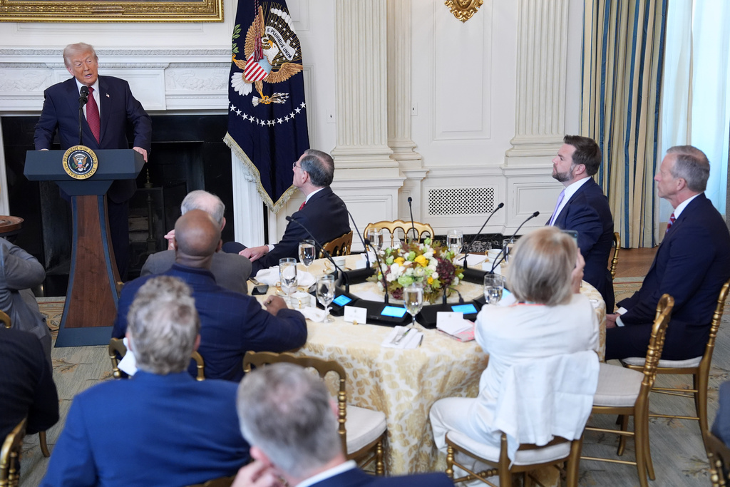 President Donald Trump speaks during a breakfast with Senate and House Republicans in the State Dining Room of the White House, Wednesday, Nov. 5, 2025, in Washington. Senate Majority Leader John Thune, R-S.D. and Vice President JD Vance, seated right. (AP Photo/Evan Vucci)