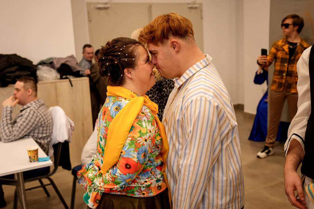 Oana Banica and Alex Zarva touch noses before the SEEN Anonymous Seamstresses Gala, an event organised by the Down Plus Bucharest, an NGO supporting youngsters with Down Syndrome and other intellectual disabilities, in Bucharest, Romania, Wednesday, March 18, 2026, ahead of the World Down Syndrome Day, on March 21. (AP Photo/ Vadim Ghirda)