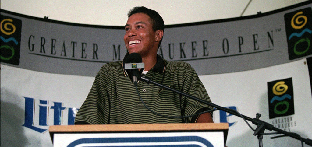 FILE - Tiger Woods answers questions at a news conference following play in the pro-am at the Greater Milwaukee Open Wednesday, Aug. 28, 1996, at the Brown Deer Golf Course, in Milwaukee. (AP Photo/Peter Zuzga, File)