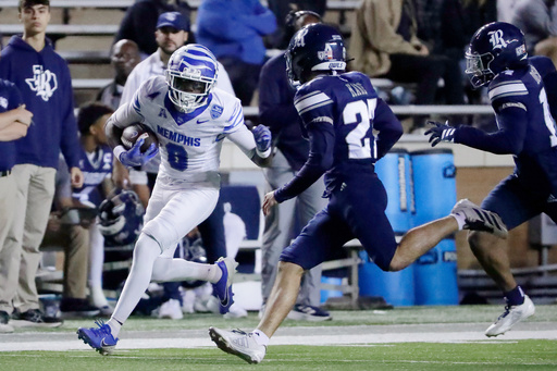 Memphis wide receiver Jadon Thompson (0) tries to avoid a tackle by Rice safety Jack Kane, center, and cornerback Ephraim Dotson, right, and during the first half of an NCAA college football game Friday, Oct. 31, 2025, in Houston. (AP Photo/Michael Wyke) Memphis wide receiver Jadon Thompson (0) tries to avoid a tackle by Rice safety Jack Kane, center, and cornerback Ephraim Dotson, right, and during the first half of an NCAA college football game Friday, Oct. 31, 2025, in Houston. (AP Photo/Michael Wyke)