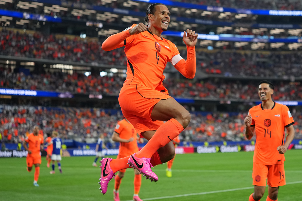 Netherlands' Virgil van Dijk (4) celebrates scoring his side's first goal against Japan during a World Cup Group F soccer match in Arlington, Texas, near Dallas, Sunday, June 14, 2026. (AP Photo/Julio Cortez)