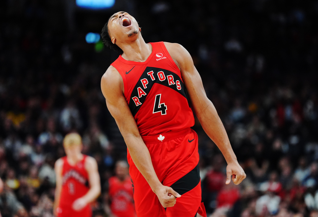 Toronto Raptors' Scottie Barnes (4) reacts after a missed shot against the Los Angeles Lakers during second-half NBA basketball game action in Toronto, Thursday, Dec. 4, 2025. (Frank Gunn/The Canadian Press via AP)