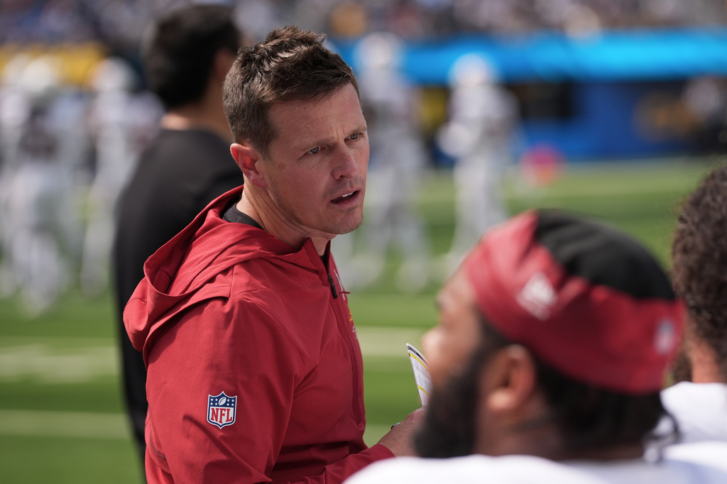 Arizona Cardinals head coach Mike LaFleur talks with players on the sideline during the first half of an NFL football game against the Los Angeles Chargers, Sunday, Sept. 13, 2026, in Inglewood, Calif. (AP Photo/Gregory Bull)