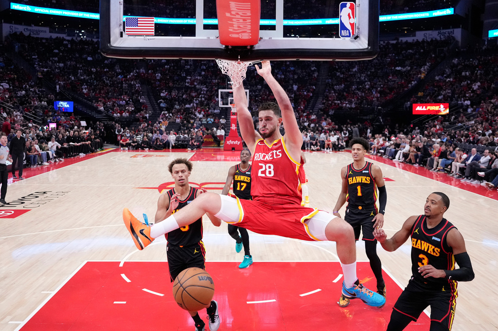 Houston Rockets center Alperen Sengun (28) dunks during the first quarter of an NBA basketball game against the Atlanta Hawks, Monday, Oct. 26, 2026, in Houston. (AP Photo/Kevin M. Cox)