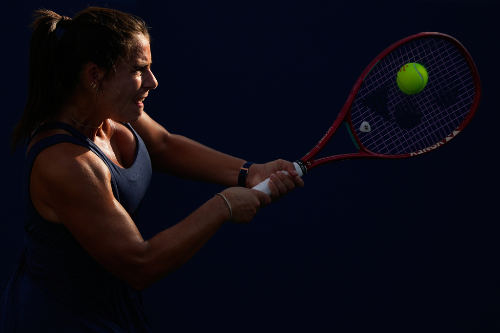 Emma Navarro, of the United States, returns the ball to Karolina Muchova, of the Czech Republic, during the third round of the U.S. Open tennis championships Friday, Sept. 4, 2026, in New York. (AP Photo/Yuki Iwamura)