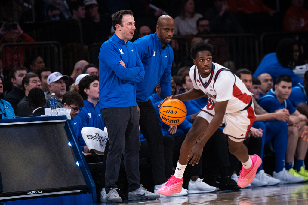 Xavier head coach Richard Pitino, front left, watches the first half of an NCAA college basketball game against St. John's, Monday, Feb. 9, 2026, in New York. (AP Photo/Angelina Katsanis)
