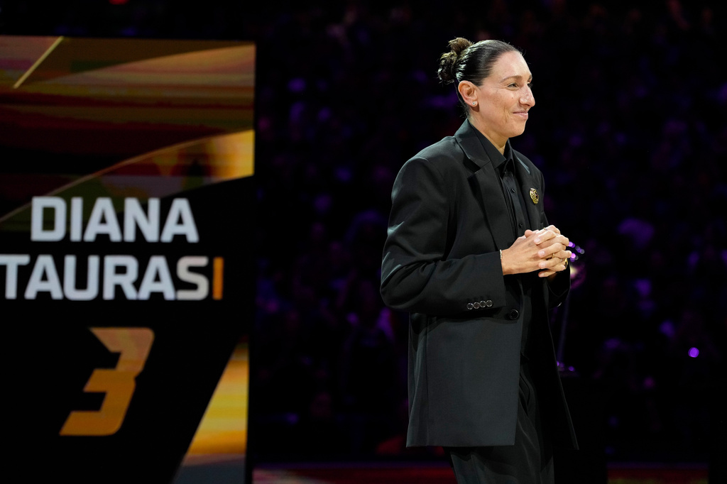 Retired WNBA Phoenix Mercury basketball player Diana Taurasi is honored during a halftime Ring of Honor ceremony Sunday, Aug. 16, 2026, in Phoenix. (AP Photo/Ross D. Franklin)