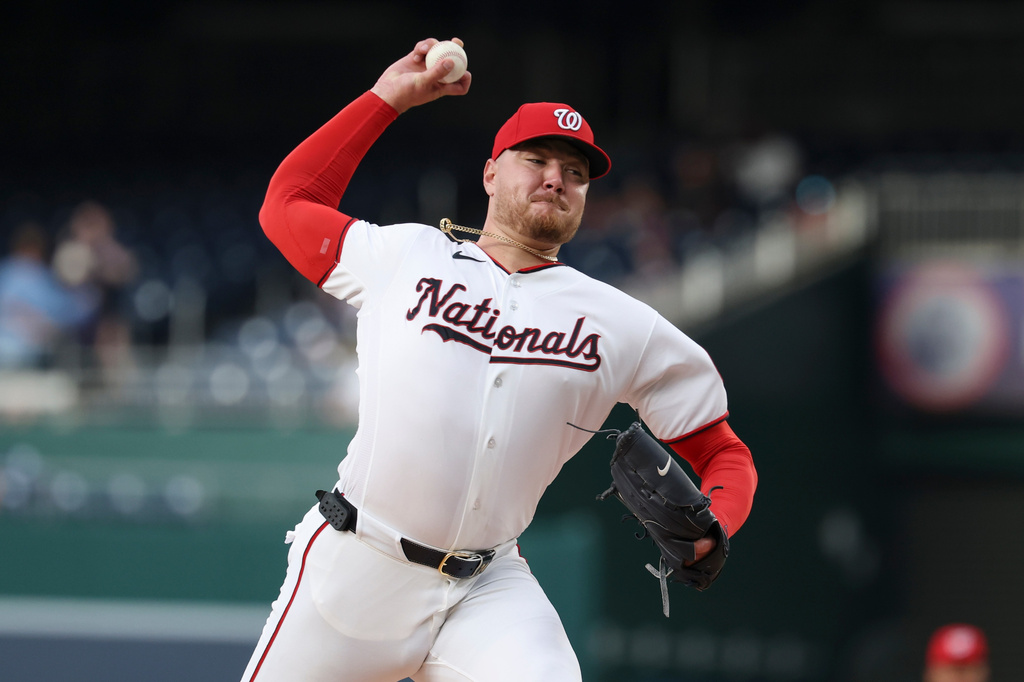 Washington Nationals pitcher Cade Cavalli throws during the first inning of a baseball game against the Colorado Rockies in Washington, Monday, Aug. 24, 2026. (AP Photo/Terrance Williams)