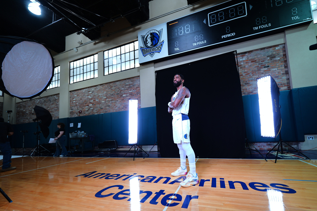 Dallas Mavericks' Kyrie Irving poses for photographs during his team's NBA basketball media day Friday, Sept. 25, 2026, in Dallas. (AP Photo/Julio Cortez)