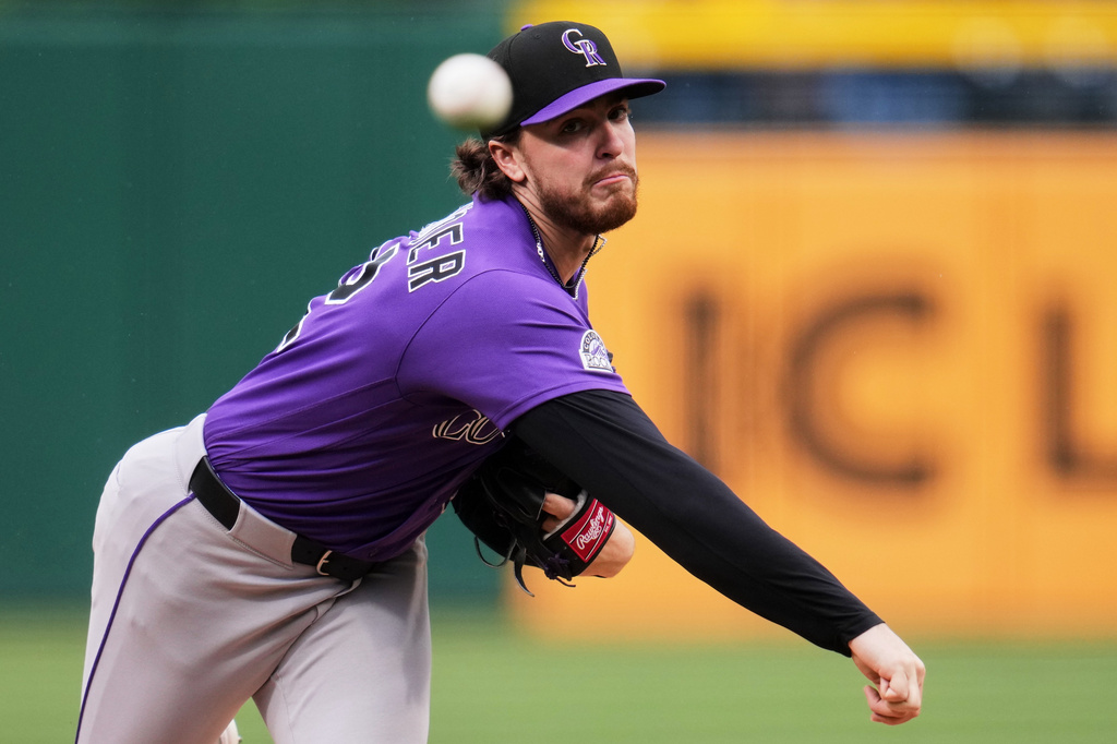 Colorado Rockies pitcher Chase Dollander delivers during the first inning of a baseball game against the Pittsburgh Pirates in Pittsburgh, Thursday, May 14, 2026. (AP Photo/Gene J. Puskar)